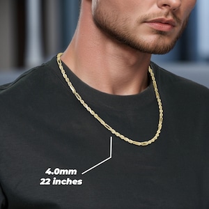 A 10k Gold Classic Milano Rope Chain Link Necklace. The necklace is solid, 4.0mm wide, and 22 inches long, suitable for both men and women. The man is wearing an active shirt and is showcasing the necklace around his neck.