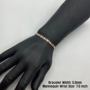 The 10k 14k Solid Gold Tri-Colored Slim Valentino Link Bracelet Anklet for Women/Girls is a gorgeous accessory available in various sizes with a 5.0mm width in a mannequin wrist size 7.0in. It’s ideal for enhancing any outfit with a touch of elegance