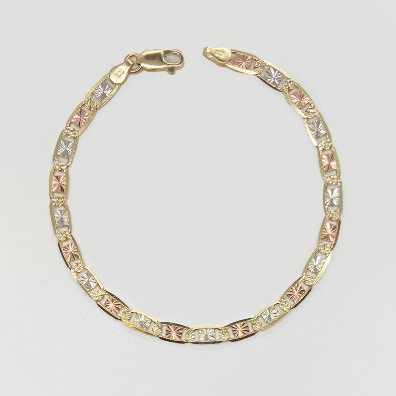 Stunning 10k & 14k solid gold tri-colored Valentino link bracelet anklet for women and girls. Features tri-colored gold for a versatile, elegant look. Adds a touch of sophistication to any outfit.