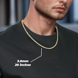 A 10k Gold Classic Milano Rope Chain Link Necklace. The necklace is solid, 3.0mm wide, and 20 inches long, suitable for both men and women. The man is wearing an active shirt and is showcasing the necklace around his neck.