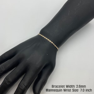 The 10k 14k Solid Gold Tri-Colored Slim Valentino Link Bracelet Anklet for Women/Girls is a gorgeous accessory available in various sizes with a 2.6mm width in a mannequin wrist size 7.0in. It’s ideal for enhancing any outfit with a touch of elegance