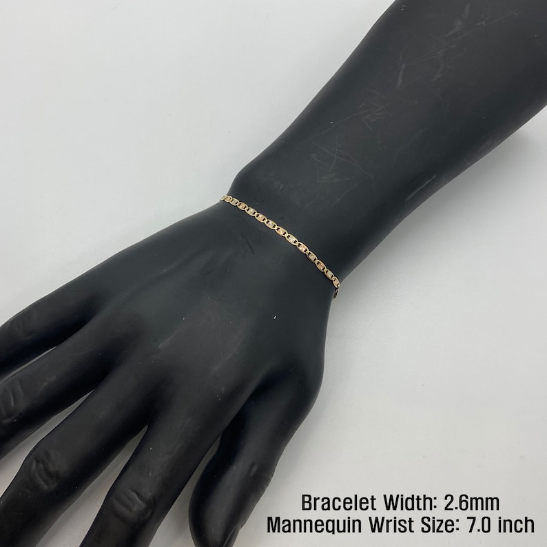The 10k 14k Solid Gold Tri-Colored Slim Valentino Link Bracelet Anklet for Women/Girls is a gorgeous accessory available in various sizes with a 2.6mm width in a mannequin wrist size 7.0in. It’s ideal for enhancing any outfit with a touch of elegance