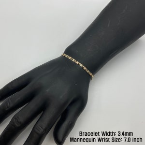 The 10k 14k Solid Gold Tri-Colored Slim Valentino Link Bracelet Anklet for Women/Girls is a gorgeous accessory available in various sizes with a 3.4mm width in a mannequin wrist size 7.0in. It’s ideal for enhancing any outfit with a touch of elegance