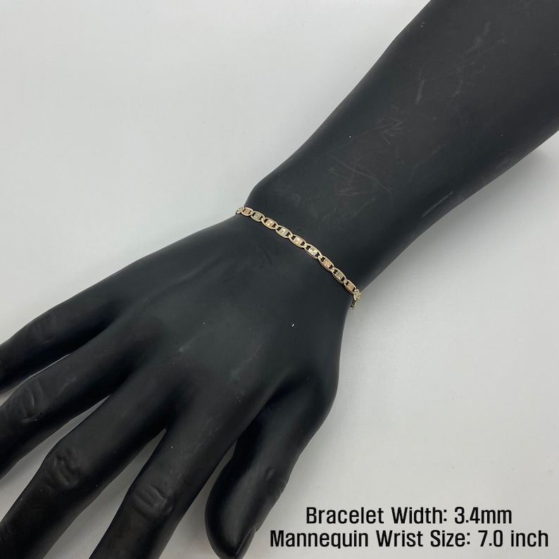 The 10k 14k Solid Gold Tri-Colored Slim Valentino Link Bracelet Anklet for Women/Girls is a gorgeous accessory available in various sizes with a 3.4mm width in a mannequin wrist size 7.0in. It’s ideal for enhancing any outfit with a touch of elegance
