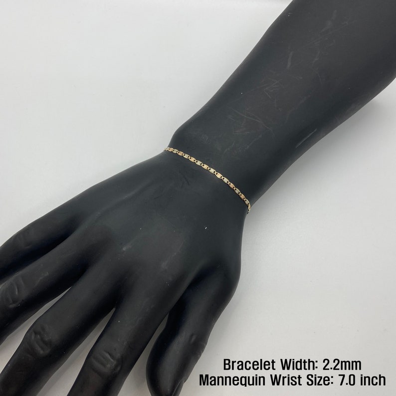 The 10k 14k Solid Gold Tri-Colored Slim Valentino Link Bracelet Anklet for Women/Girls is a gorgeous accessory available in various sizes with a 2.2mm width in a mannequin wrist size 7.0in. It’s ideal for enhancing any outfit with a touch of elegance