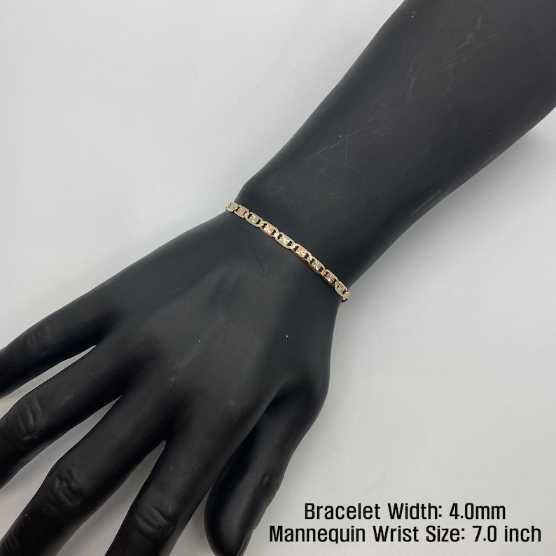 The 10k 14k Solid Gold Tri-Colored Slim Valentino Link Bracelet Anklet for Women/Girls is a gorgeous accessory available in various sizes with a 4.0mm width in a mannequin wrist size 7.0in. It’s ideal for enhancing any outfit with a touch of elegance