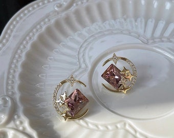 Anime Sailor moon.phrase studs. Gold Celestial earrings.Purple diamond earrings.