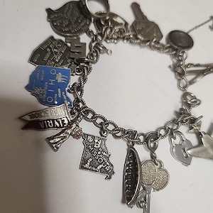 Vintage 1960&#39;s Sterling Silver Charm Bracelet with 16 charms