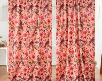May include: A pair of pink curtains with a floral and bird print. The curtains feature a repeating pattern of pink flowers, green leaves, and colorful birds.