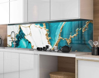 May include: A kitchen backsplash with a blue, white, and gold abstract marble design. The backsplash is installed above a white kitchen counter with a wicker basket.