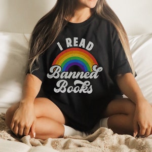 May include: A black t-shirt with a rainbow and the text "I Read Banned Books" in white.