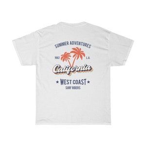 May include: White t-shirt with a retro-style graphic design featuring palm trees and the text "Summer Adventures 1982 California L.A. West Coast Surf Riders".