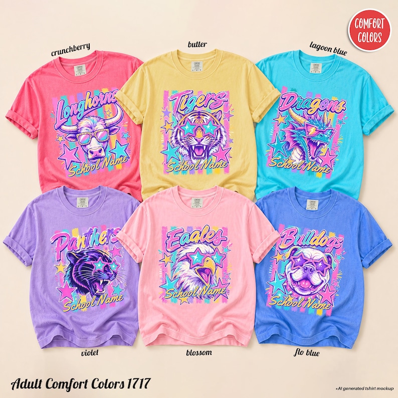 May include: Six short-sleeve t-shirts in crunchberry, butter, lagoon blue, violet, blossom, and flo blue. Each shirt features a graphic of an animal wearing star-shaped glasses, colorful stripes, stars, and the text School Name and team names.