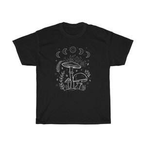 May include: Black t-shirt featuring a white outline of mushrooms and a crescent moon design.