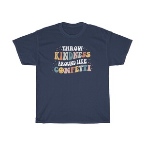 May include: Navy blue t-shirt with a retro-style graphic that says "Throw Kindness Around Like Confetti" in colourful letters with a smiley face.