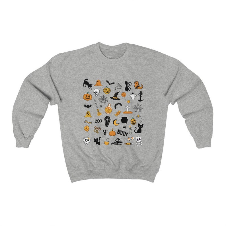 May include: A gray sweatshirt with a Halloween-themed design featuring a variety of black and orange icons, including pumpkins, bats, ghosts, witches, and skulls.