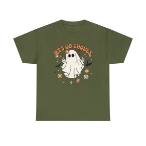 May include: A green t-shirt with a white ghost wearing a peace sign and the text "Let's Go Ghouls" in orange and white.