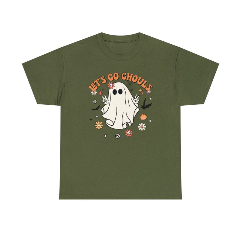 May include: A green t-shirt with a white ghost wearing a peace sign and the text "Let's Go Ghouls" in orange and white.