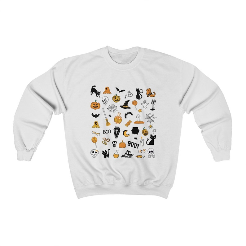May include: White sweatshirt with a black and orange Halloween-themed print. The print features various icons such as pumpkins, ghosts, bats, witches, skulls, and more.