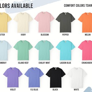 May include: A color chart for Comfort Colors 1717 t-shirts displaying fourteen short-sleeve shirts in various shades including butter, ivory, blossom, pepper, melon, chambray, island reef, chalky mint, lagoon blue, crunchberry, violet, flo blue, black, and white.