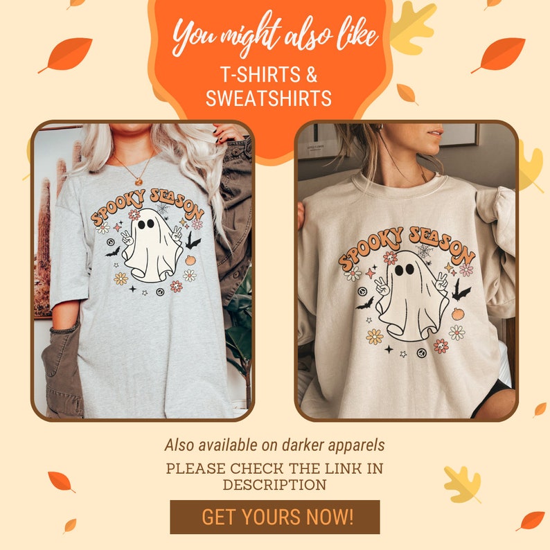 May include: Two beige shirts with a graphic print of a ghost with the text "Spooky Season" in a retro font. The ghost is wearing a peace sign necklace and has two eyes. The shirts are decorated with flowers, bats, and stars.