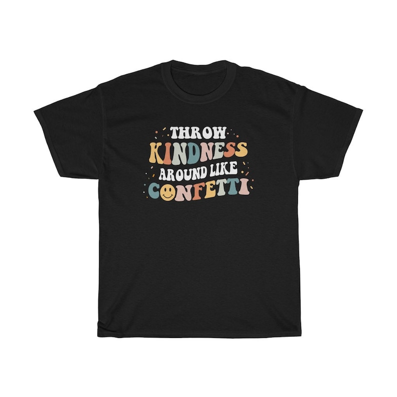 May include: Black t-shirt with the text "Throw Kindness Around Like Confetti" in colourful retro font with a smiley face.
