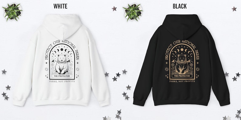 May include: White and black hoodies with a graphic design on the back. The design features a bear, crescent moons, and the text "PROTECT OUR NATIONAL PARKS" and "PARKS, NOT PROFITS".