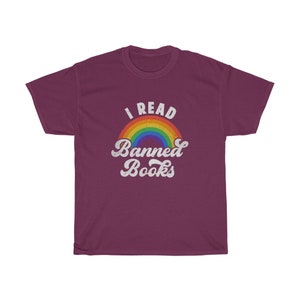 May include: A maroon t-shirt with a rainbow and the text "I Read Banned Books" in white.