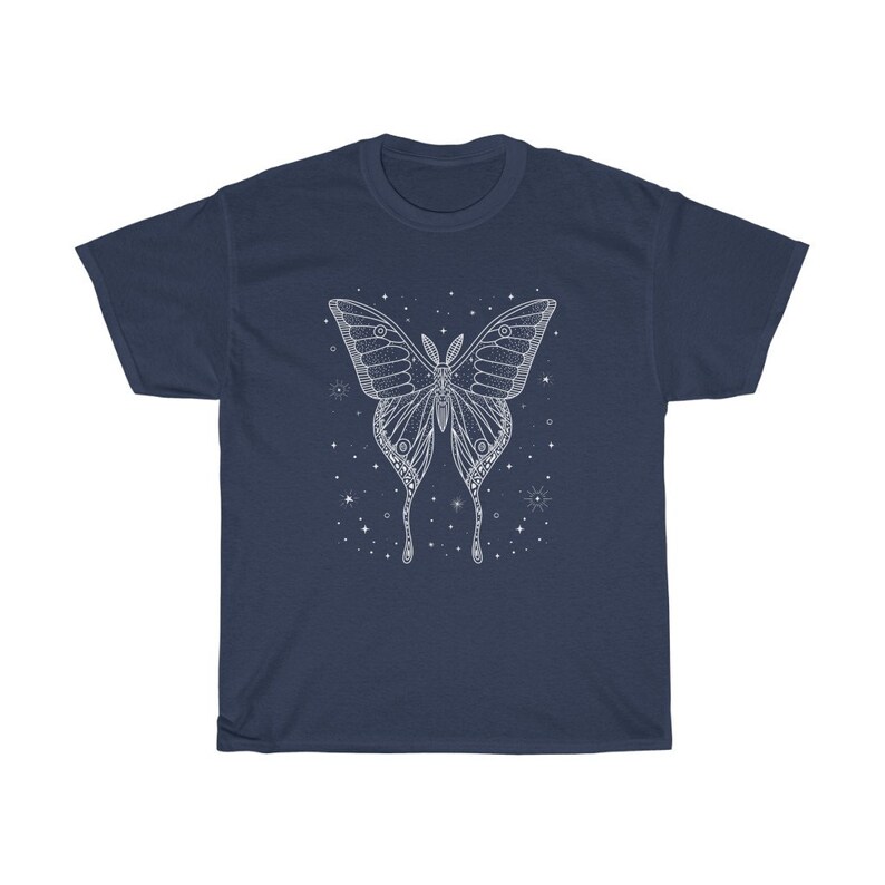 May include: A navy blue t-shirt with a white outline of a butterfly with intricate details. The butterfly is surrounded by small white stars.