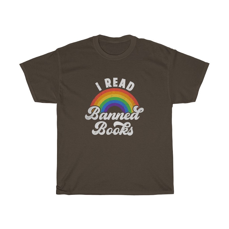 May include: A brown t-shirt with a rainbow and the text "I Read Banned Books" in white.