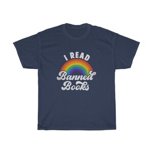 May include: A navy blue t-shirt featuring a rainbow graphic and the text "I Read Banned Books" in white.