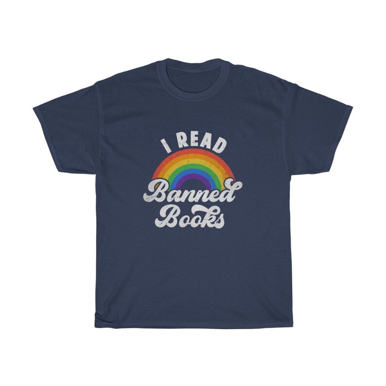 May include: A navy blue t-shirt featuring a rainbow graphic and the text "I Read Banned Books" in white.