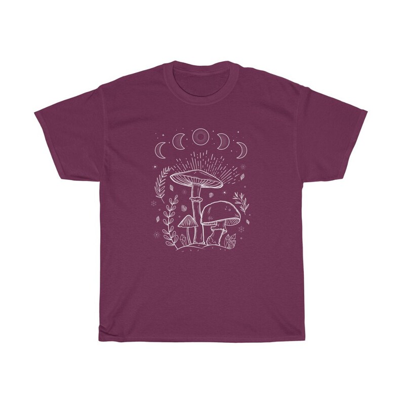 May include: A maroon t-shirt featuring a white outline of mushrooms and a crescent moon design.