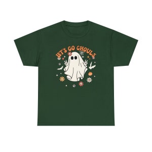 May include: A dark green t-shirt with a white ghost wearing a flower crown and peace signs. The text "Let's Go Ghouls" is in orange and yellow letters.