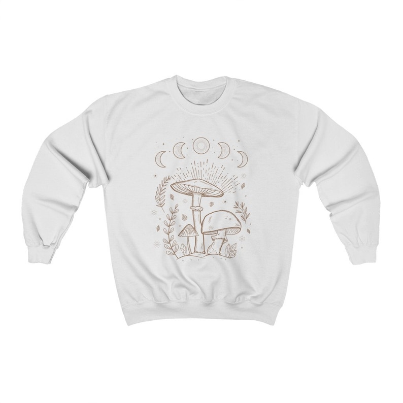 May include: White sweatshirt featuring a brown line drawing of mushrooms and a crescent moon phase design.