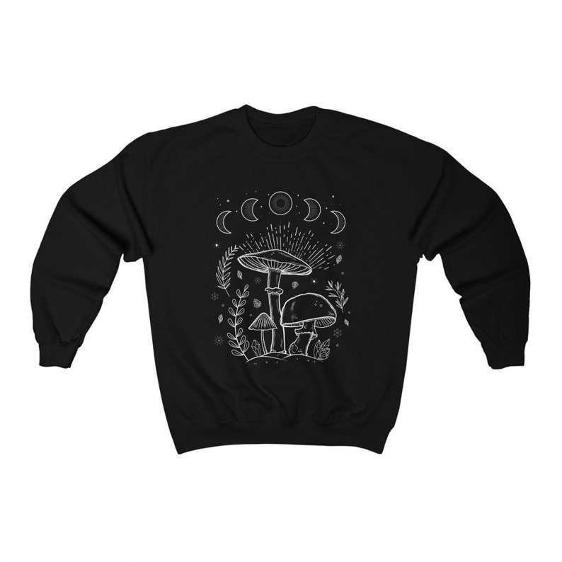 May include: Black sweatshirt featuring a white outline of mushrooms and a crescent moon design.