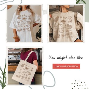 May include: Three images showing a white t-shirt, a beige sweatshirt, and a beige tote bag, all featuring a brown line drawing of various mushrooms and other forest elements. The text "You might also like" and "LINK IN DESCRIPTION" are visible at the bottom of the image.