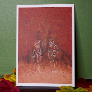 May include: A rectangular art print featuring a white line drawing of two figures standing and facing each other. The background is a textured, gradient wash of deep red, orange, and brown tones, resembling autumn foliage in a forest setting.
