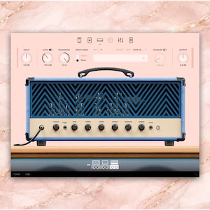 May include: A blue and cream-colored guitar amplifier head with a black handle and control knobs. The front features a blue geometric design. The amplifier is set against a pink background with a marble texture.