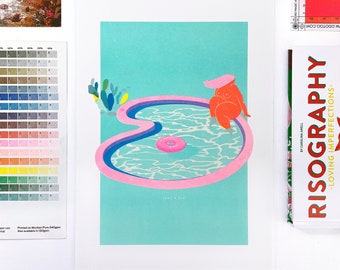 May include: A pink and blue illustration of a person relaxing in a pool with a pink inflatable ring. The text "Take a Dip" is printed below the pool.