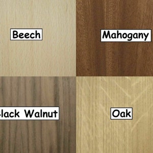May include: A sample of four different wood types: Beech, Mahogany, Black Walnut, and Oak. Each wood sample is labeled with its name in a white rectangular box. The Beech sample is light tan, the Mahogany is dark brown, the Black Walnut is dark brown with black streaks, and the Oak is light tan.