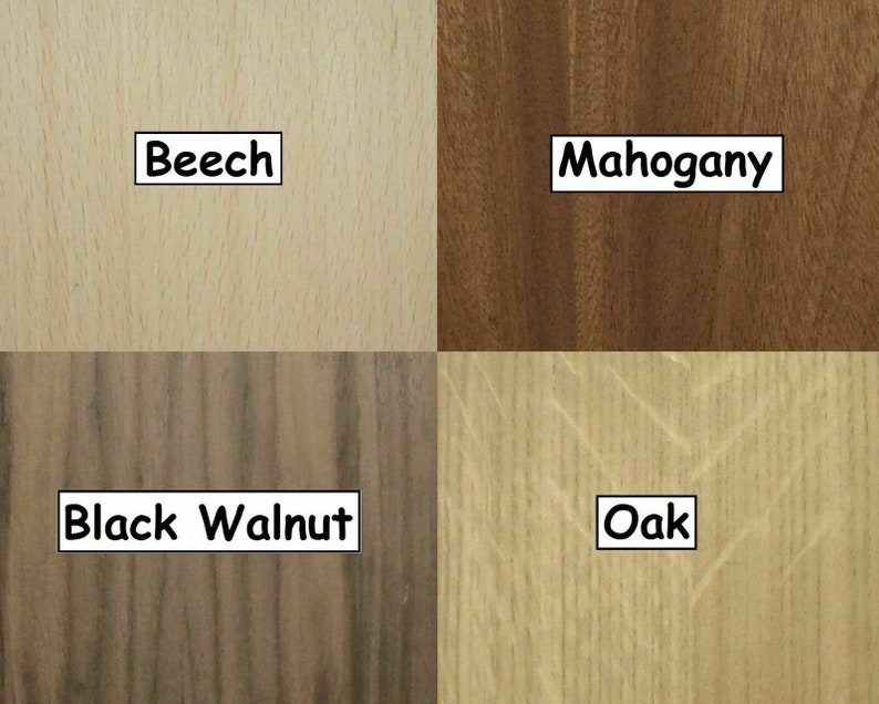 May include: A sample of four different wood types: Beech, Mahogany, Black Walnut, and Oak. Each wood sample is labeled with its name in a white rectangular box. The Beech sample is light tan, the Mahogany is dark brown, the Black Walnut is dark brown with black streaks, and the Oak is light tan.