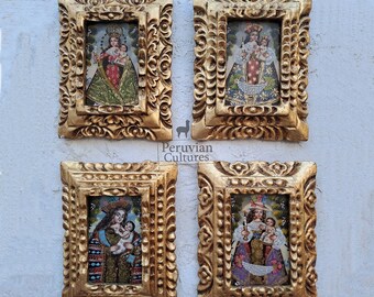 May include: Four framed religious art pieces with gold-colored ornate frames. Each frame contains a colorful image of a religious figure holding a child. The frames are displayed against a white textured background.