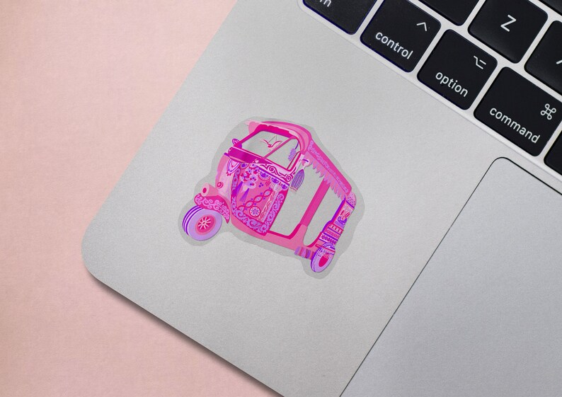 May include: A pink and purple auto rickshaw with intricate floral designs. The rickshaw is a popular mode of transportation in many parts of Asia.