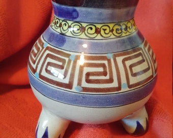Vintage Tonala Mexican Art Pottery Vase. Blue, yellow, and brown geometric design on three footed base.