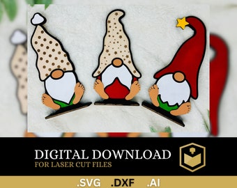 May include: Three wooden gnome ornaments with different colored hats. The gnome on the left has a brown hat with white polka dots, the gnome in the middle has a brown hat with white stars, and the gnome on the right has a red hat with a yellow star on top.