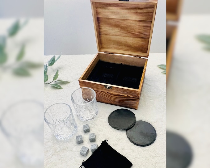 Engraved whiskey glasses set in a wooden presentation box