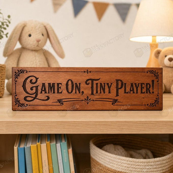 Laser-engraved kids wall sign saying 'Game On, Tiny Player!' displayed in a nursery.