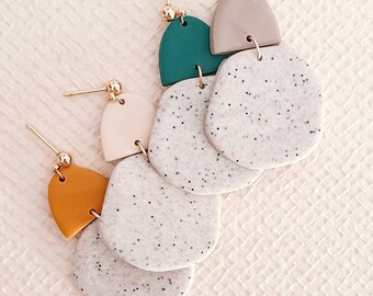 UDONGO WA KIKABONI. Polymer clay earrings. Handmade. Various colors: green, brown, beige, and mustard.