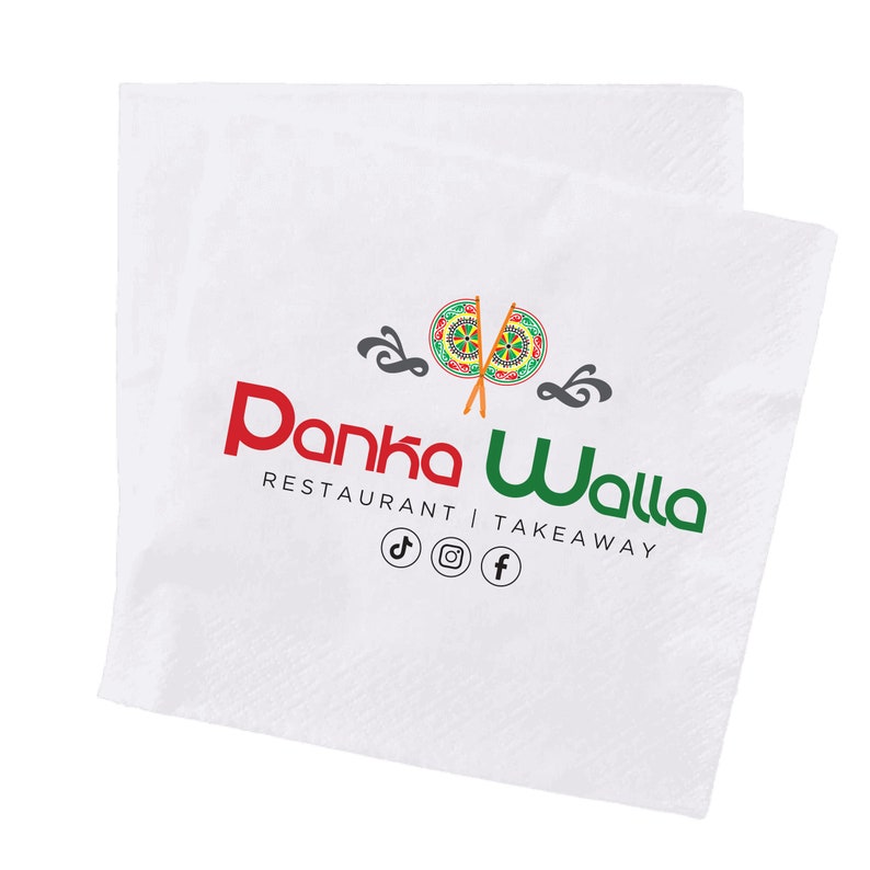 May include: White paper napkin with the text "Panka Walla Restaurant | Takeaway" in red and green. The napkin has a logo with two colorful circular designs and social media icons.